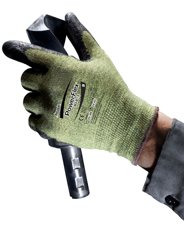 Picture of a gloved hand holding a drill bit.